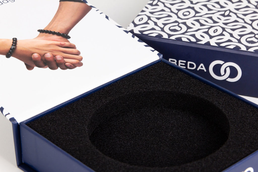 A view of the inserts for the custom packaging of Beda Beads.